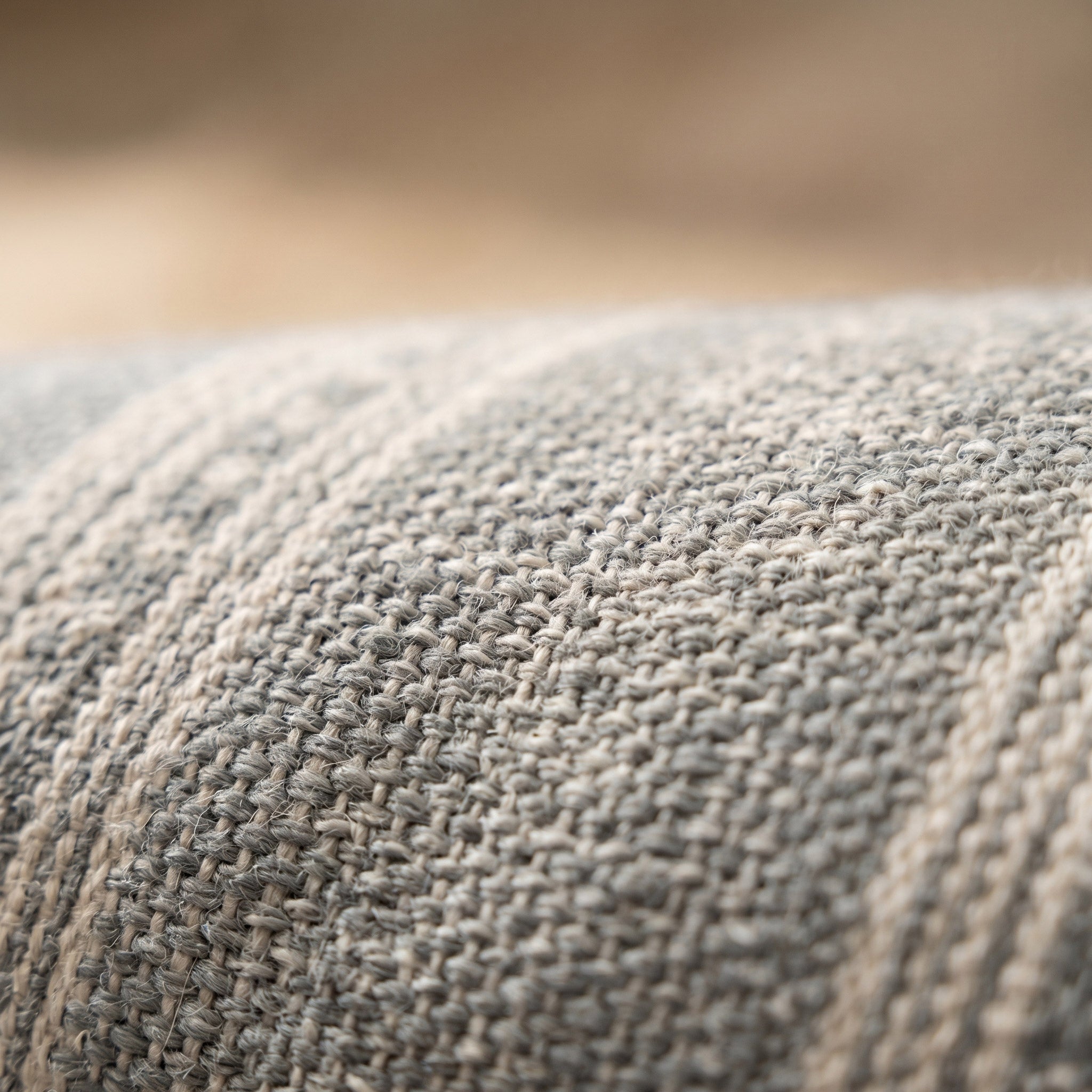 Close-up of the natural fiber texture and handmade tassels on an eco-friendly rug